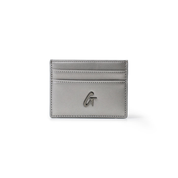 Gunmetal gray card holder with multiple card slots, a sleek design, and a metallic logo on the front.