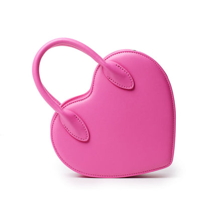 Pink heart-shaped bag with a curved handle and stitched details, designed for a stylish accessory.