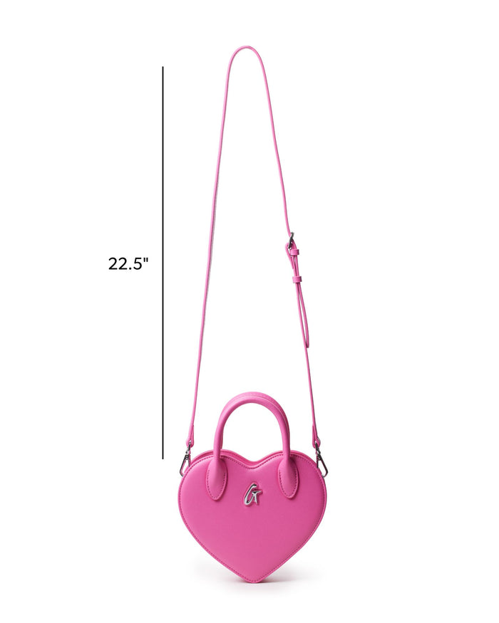 Pink heart-shaped handbag with a stylish handle and adjustable strap, perfect for adding a pop of color to any outfit.