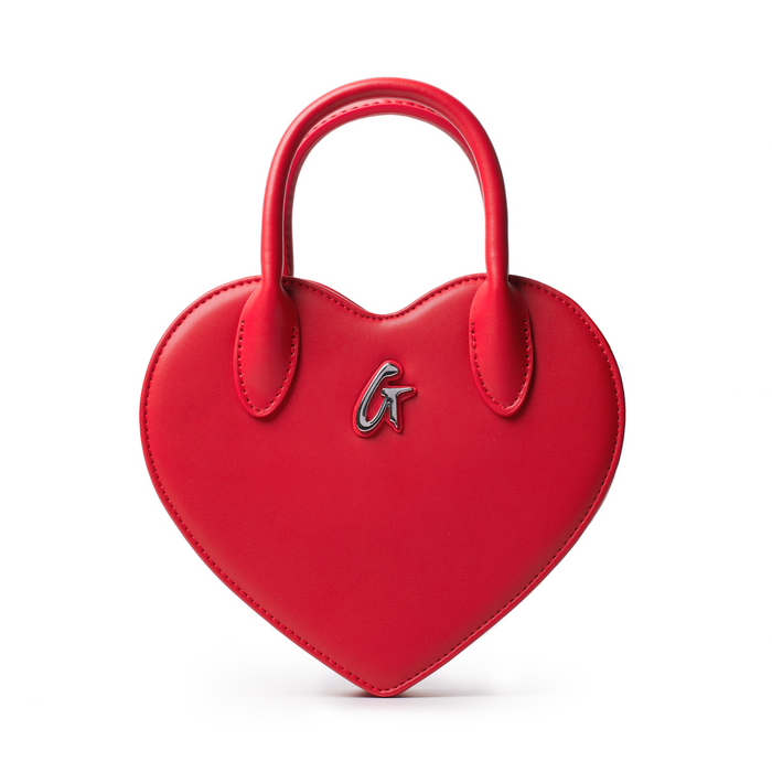 Red heart-shaped handbag with a sleek design and top handles, featuring a stylish logo detail. Perfect for a chic look.