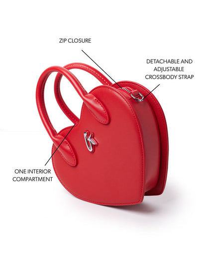 Red heart-shaped handbag featuring a zip closure, detachable adjustable crossbody strap, and one interior compartment.
