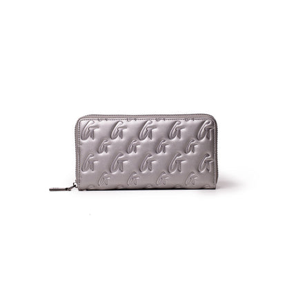 Silver platinum wallet with embossed G monogram pattern, zip closure, and sleek rectangular design.