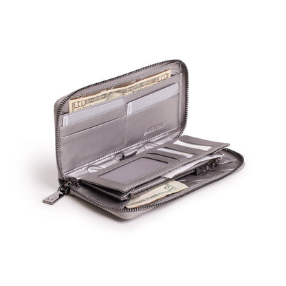Open platinum-colored wallet with multiple card slots, cash compartments, and a zipper closure, featuring a monogram design.