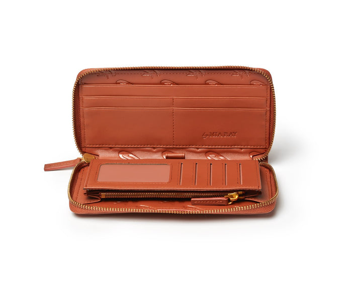Open brown wallet with multiple card slots, zipper compartment, and interior branding, designed for organization.