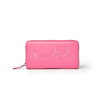 Hot pink wallet with embroidered "Glamatic Lifestyle" logo, zip closure, and sleek rectangular design.