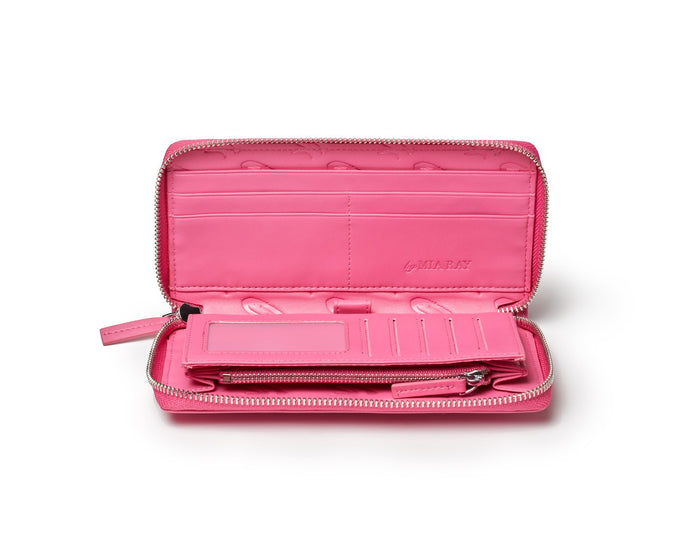Open hot pink wallet with multiple card slots, a zippered coin pocket, and "by MIA RAY" embossed inside.
