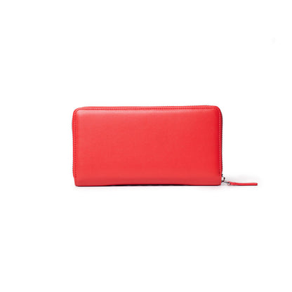 Red leather wallet with a zip-around closure, featuring a subtle signature logo on the front.
