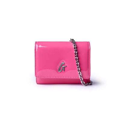 Hot pink compact wallet on a chain with a glossy finish and silver logo detail, perfect for stylish outings.