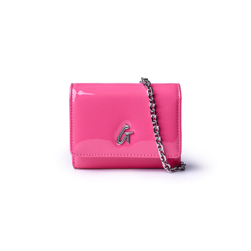Hot pink compact wallet on a chain with a glossy finish and silver logo detail, perfect for stylish outings.