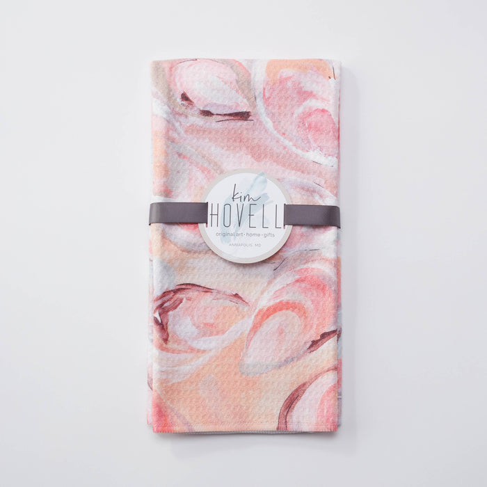 Towel with pink oyster pattern against white background