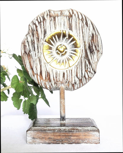 Table Decoration. Decorative hand carved wooden floral disc on stand.