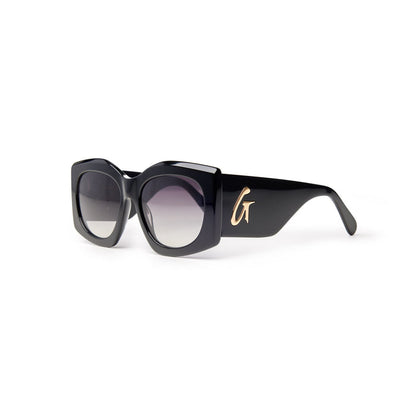 Stylish black oversized sunglasses with gradient lenses and a gold logo detail on the side, perfect for a chic look.