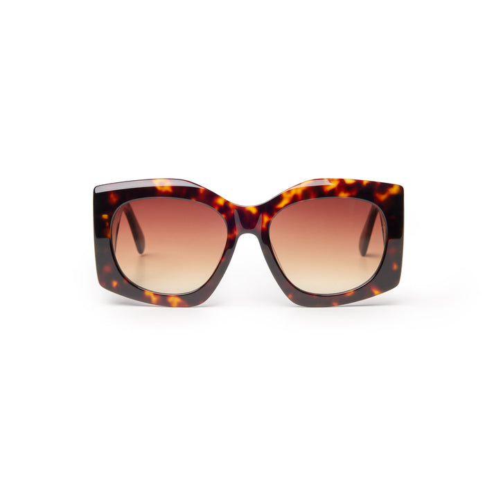 Oversized tortoise shell sunglasses with gradient lenses, featuring a bold square frame for a chic, stylish look.