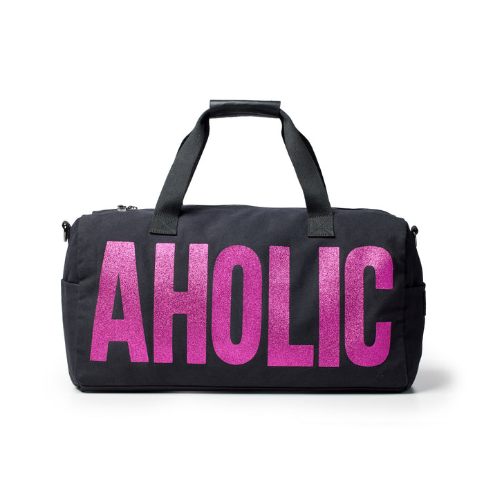 Black canvas duffle bag featuring bold pink "AHOLIC" lettering, perfect for stylish travel and everyday use.