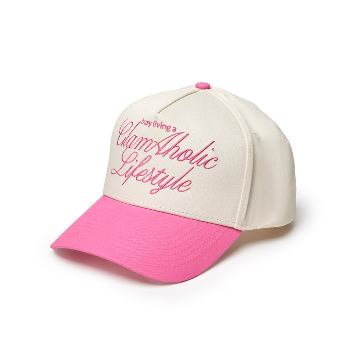 Hot pink trucker hat with white front panel and embroidered "Glam-Aholic Lifestyle" text in pink.