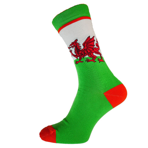 A pair of colorful socks featuring a Welsh red dragon design on a green background with a white stripe at the top, and red tips.