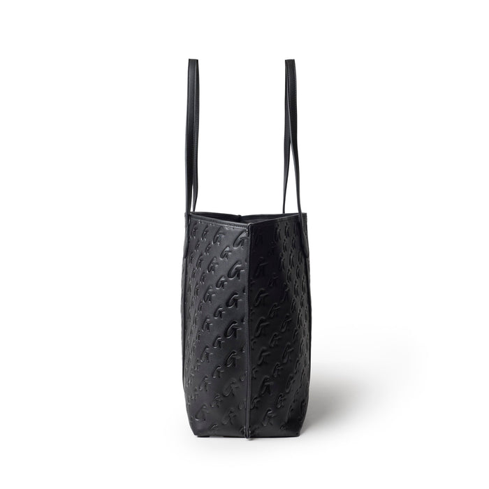 Sleek black tote bag with embossed monogram design and long handles, perfect for stylish everyday use.