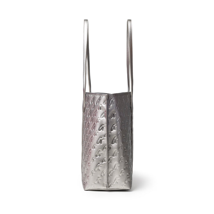 Sleek platinum XL monogram tote with embossed pattern and long straps, perfect for stylish everyday use.
