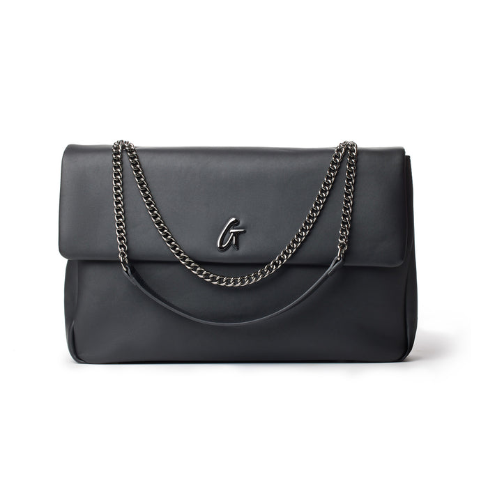 Black XL standard flap bag with chain straps and a metal logo on the front.