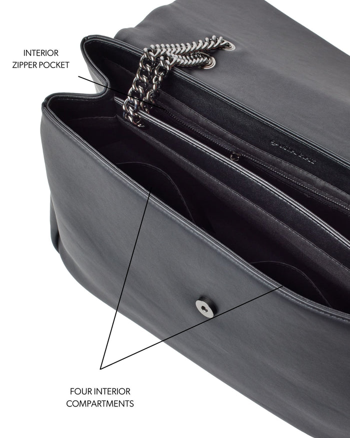 XL Standard Flap Bag in black featuring a sleek design, interior zipper pocket, and four spacious compartments.
