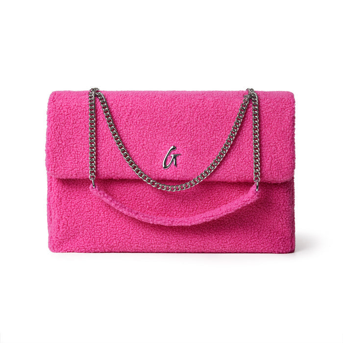 Large hot pink teddy flap bag with a silver chain strap and a metal "G" logo on the front.