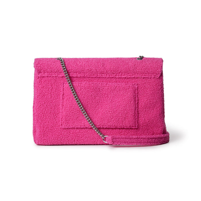 Large hot pink teddy flap bag with a silver chain strap and textured, plush fabric.