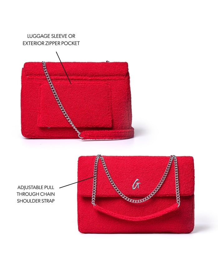 Red XL Teddy Flap Bag featuring a luggage sleeve, exterior zipper pocket, and adjustable chain shoulder strap.